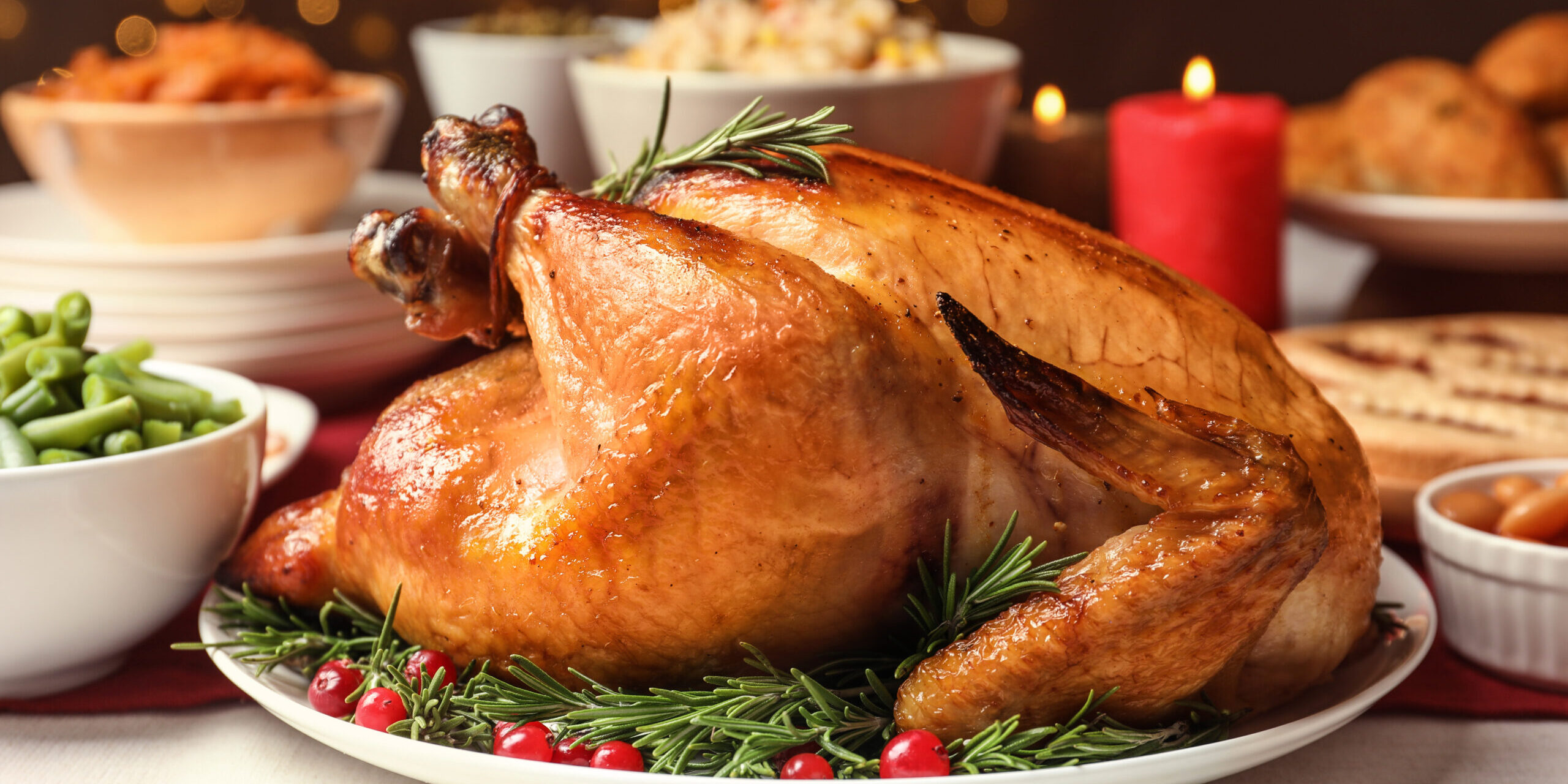 Traditional Festive Dinner With Delicious Roasted Turkey Served On Table